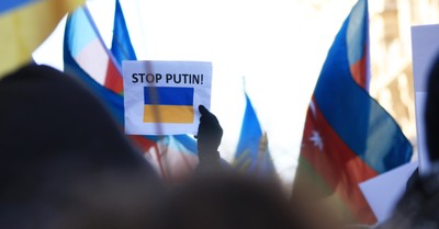 Stop Putin sign, Ukrainian President Volodymyr Zelenskyy warns that Russia will face an 'international tribunal'