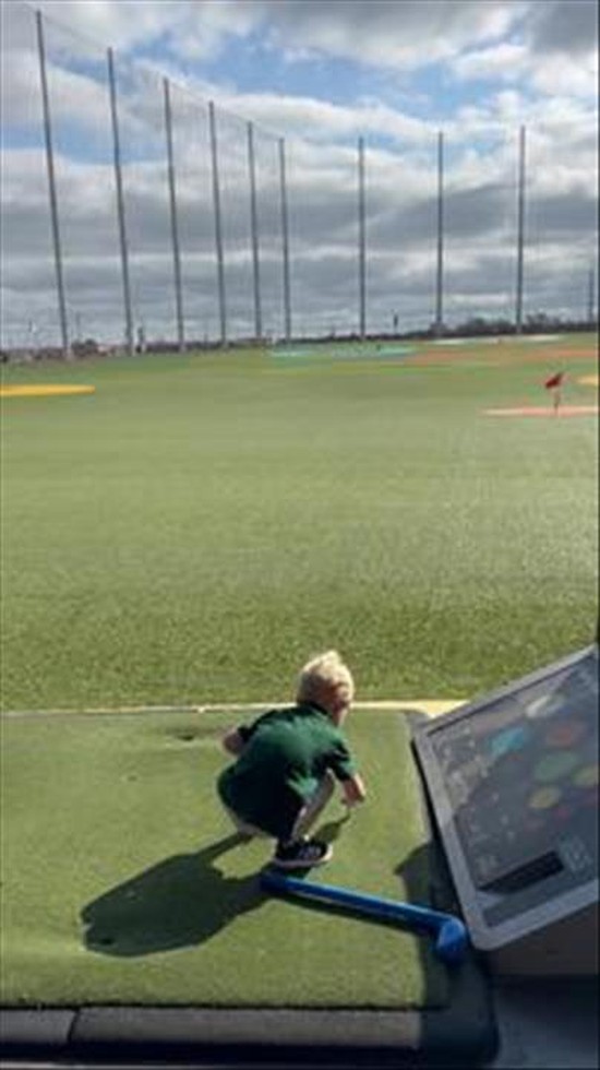 Little Man at the Driving Range