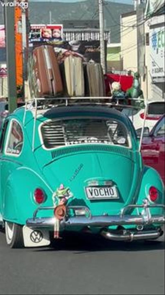 Woody and Buzz in a Predicament on a VW Beetle