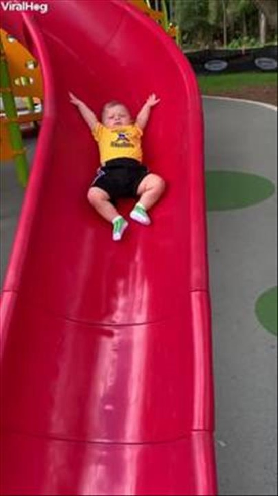 Baby Slips Slowly Down Slide