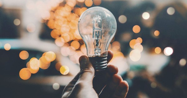 hand holding a lightbulb, light of the world