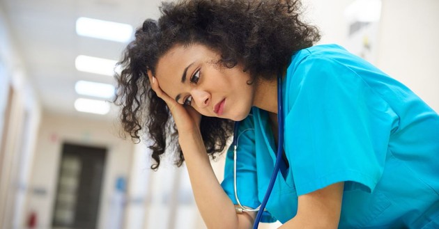 woman having a bad day in nurse uniform, bad day