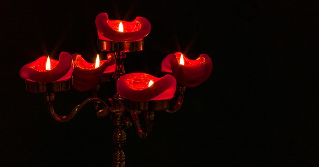 five red candles burning all the way down