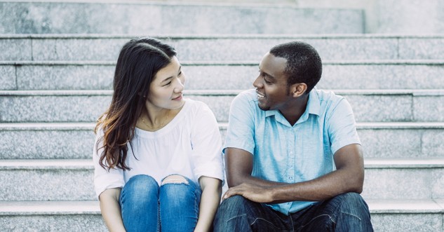 asian woman and black man smiling at each other racial reconciliation
