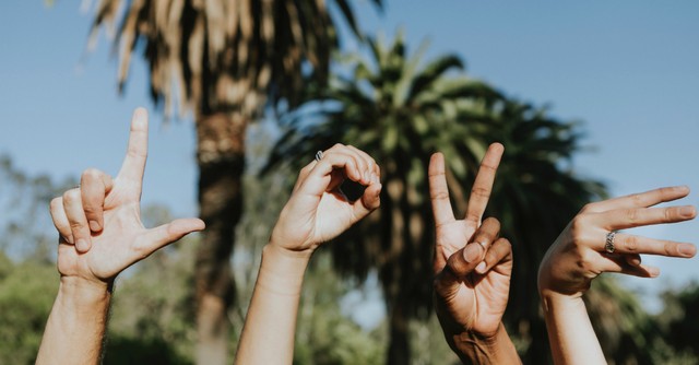 Hands spelling L-O-V-E