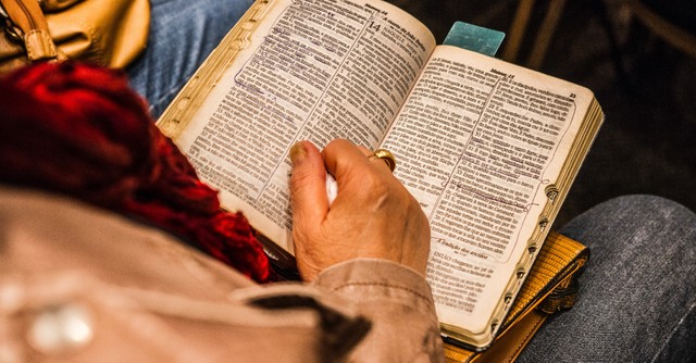Woman reading an open Bible