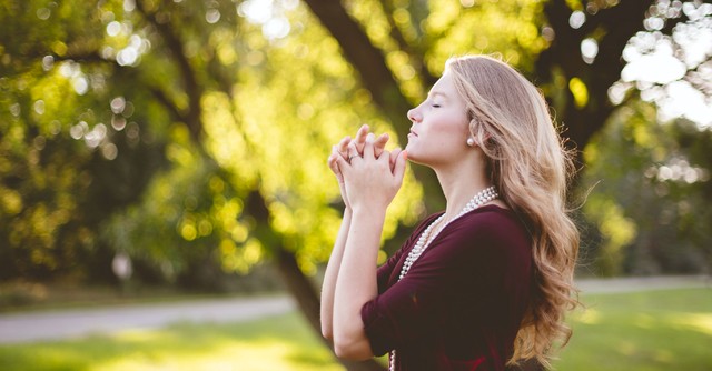 Woman praying outside