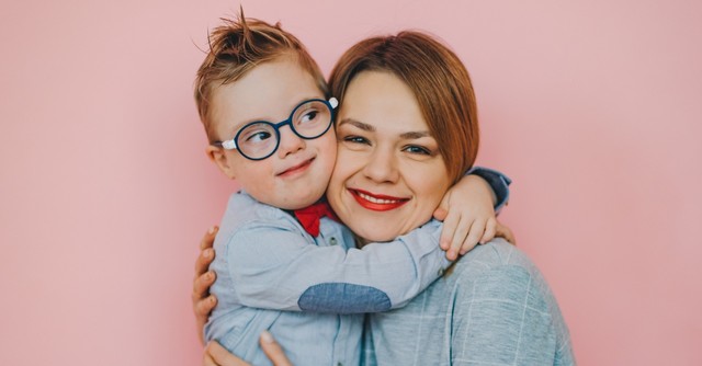 Mom posing with her young son