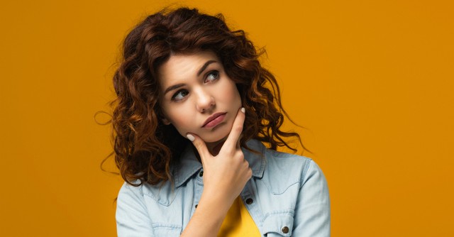 woman looking off to side wondering question