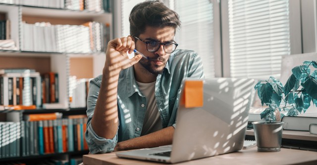 man studying online