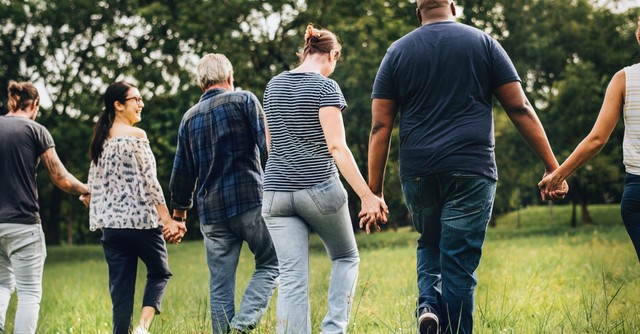 Diverse group of people walking together