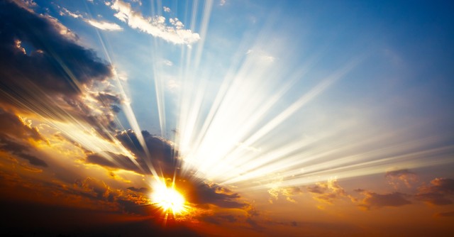 sun bursting through clouds looking like heaven