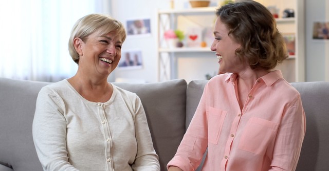 woman with older lady laughing and talking