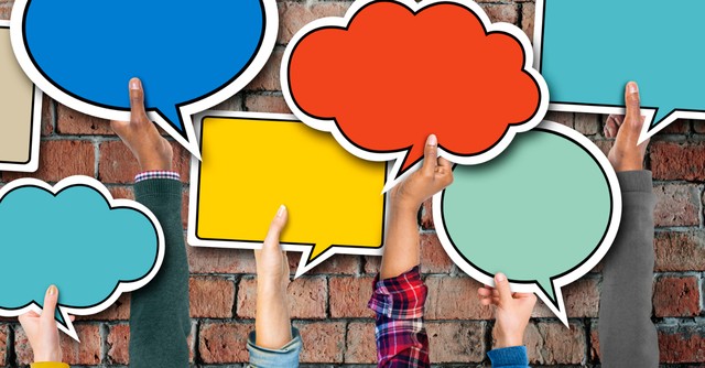 multi-ethnic group of hands holding speech bubbles