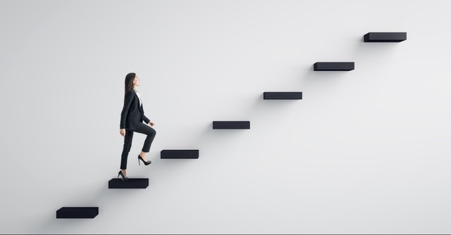Woman climbing a series of stairs