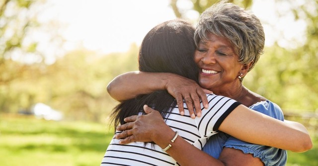 older mother hugging adult child daughter; tell your family and friends you're grateful for them