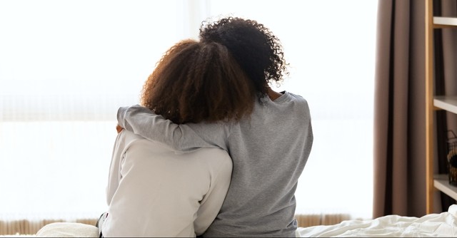 Two friends hugging