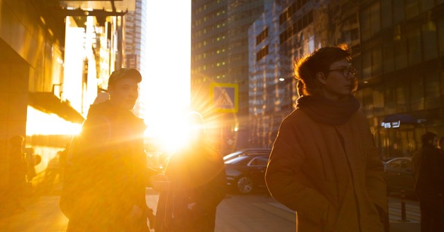 street scene people walking morning light