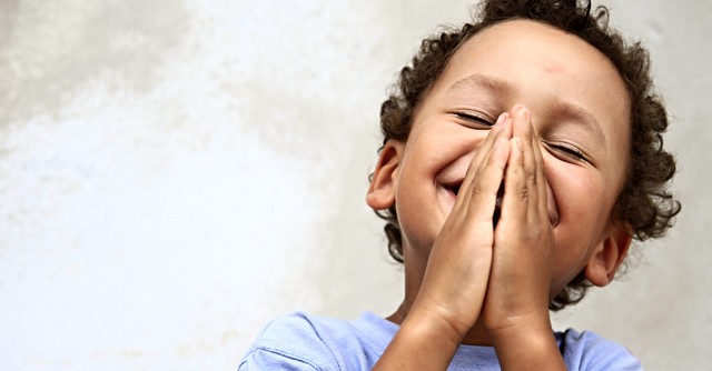 little boy praying happy