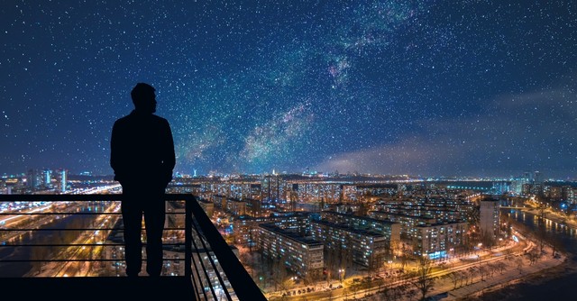 Man looking over a starscape