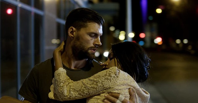 A man holding a woman in Priceless