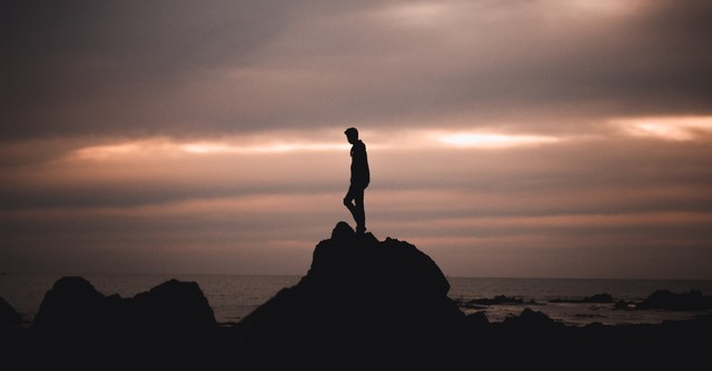 a man on a rock, You are a body... not in one