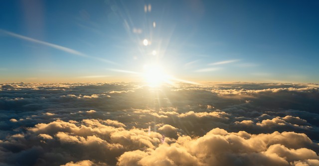 bright sky with clouds and sun burst