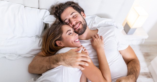 Husband and wife cuddling