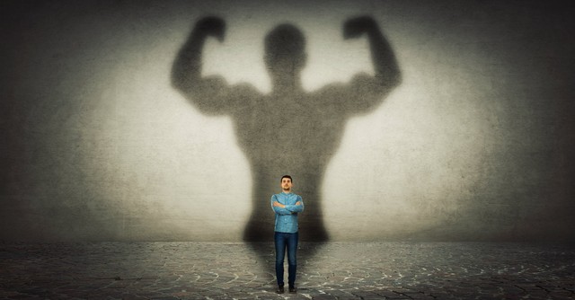 Man with a much larger shadow