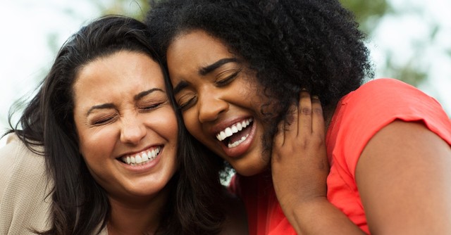 Two women friends laughing