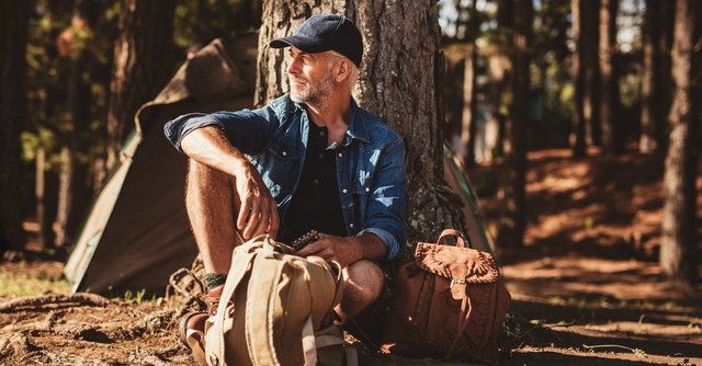 Senior man outside camping