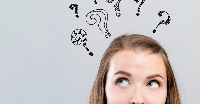 Woman with hand-drawn question marks above her head