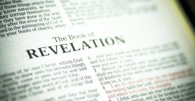 Close up of the book of Revelation, i am the alpha and the omega