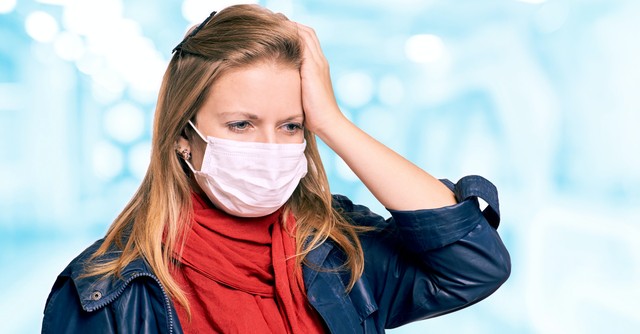 worried woman in a mask