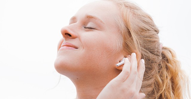 Woman peacefully listening to music
