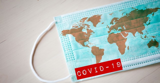 world map printed on COVID-19 face mask