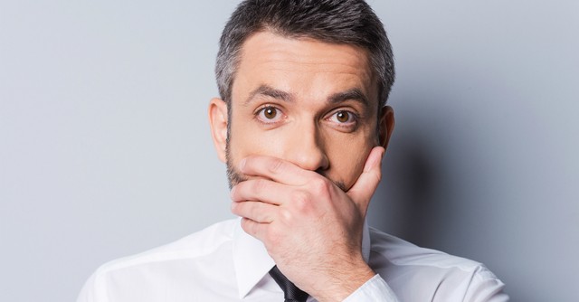 Man covering his mouth with his hand