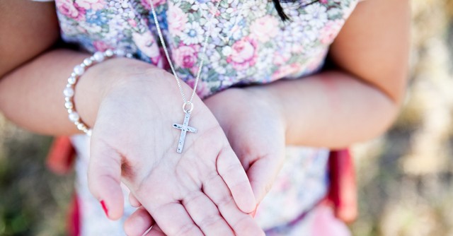 a person wearing a cross necklace, VA governor signs a law protecting outward expressions of faith
