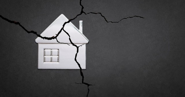 Illustration of a house with all cracks across it