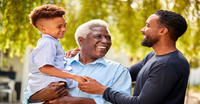 Grandfather holding grandson while son smile, train up a child