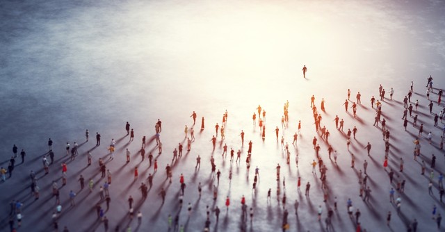 A large crowd following one person
