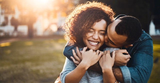 Man kissing woman