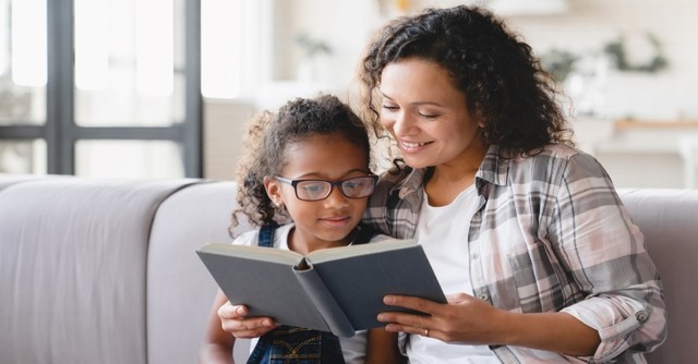 mother reading to child, teaching children catechesis