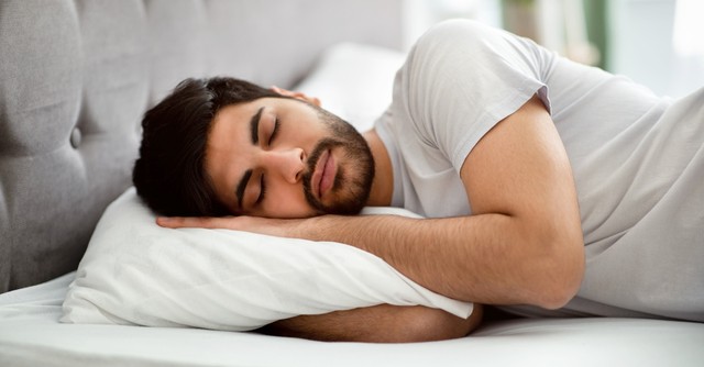 Man sleeping in bed