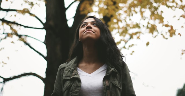 A hopeful woman looking up; tuesday morning prayer for hope