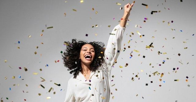 Woman throwing confetti