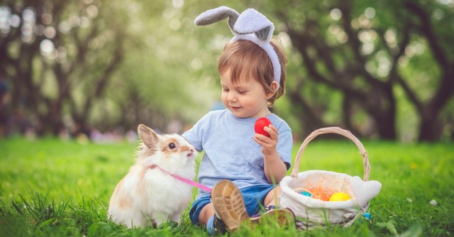 Child with a bunny and eggs