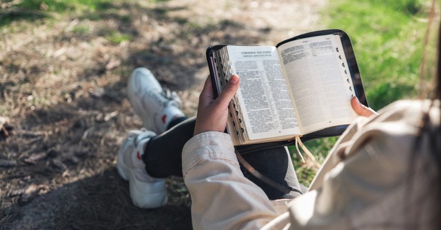 someone reading the Bible in the morning