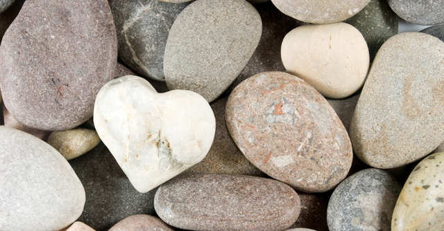 A heart shaped rock among other rocks