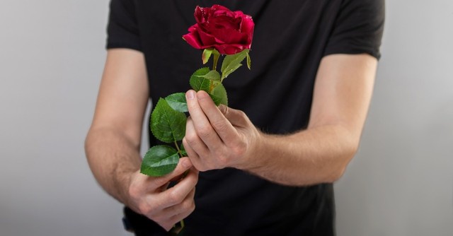 man holding rose